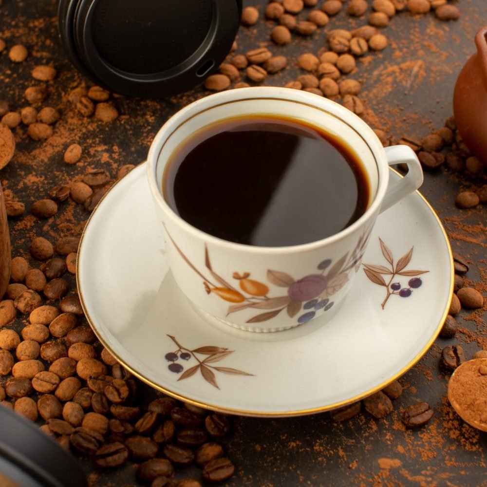 front-view-brown-coffee-seeds-with-choco-bars-cup-coffee-all-brown-surface-coffee-seed-grain-granule